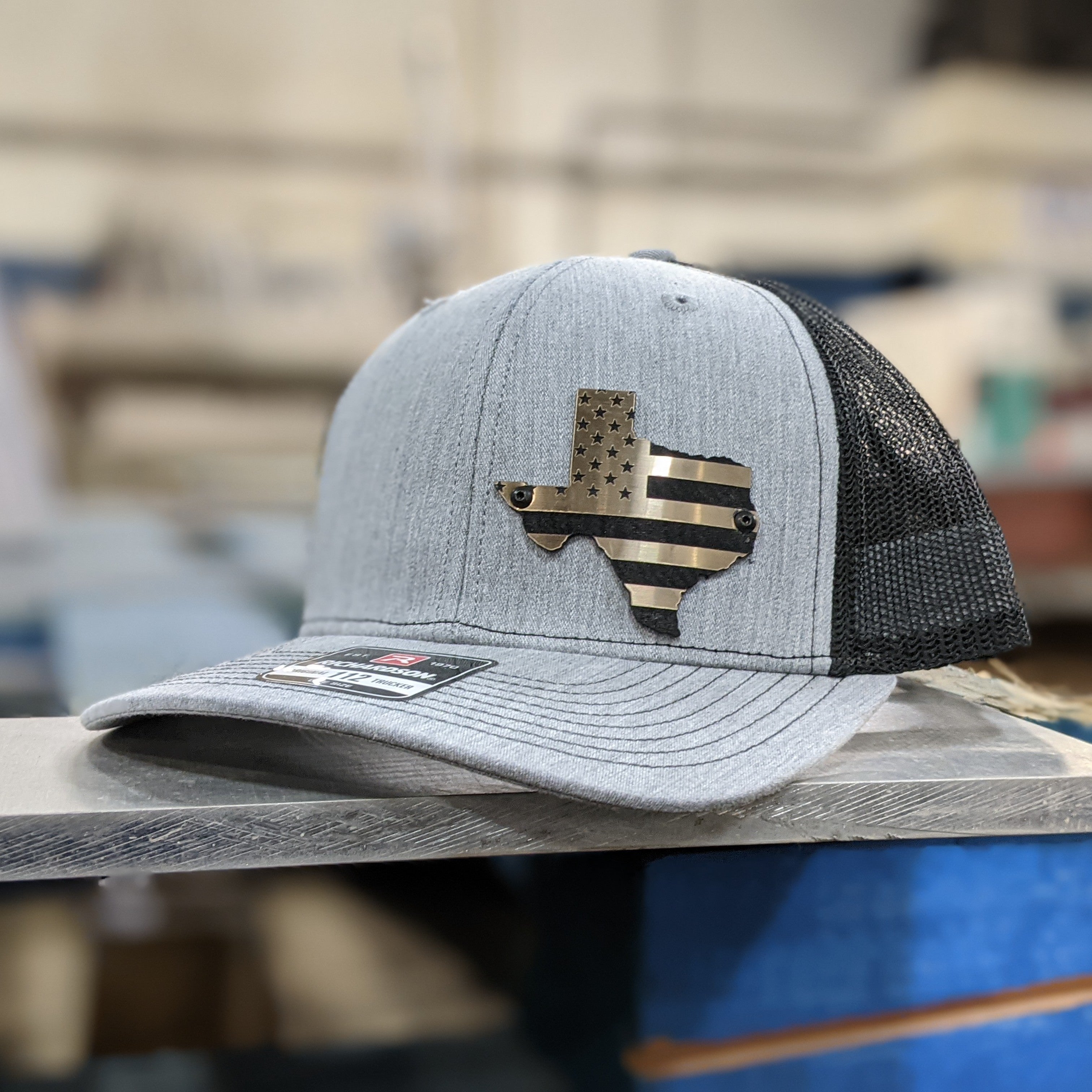 Custom Company Badge Hats With Logo - Mesh Trucker Hat – Brushed Gold/Black Badge - Economy - Headgear Hats Imagen principal del producto