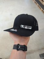 Custom Company Badge Hats With Logo - Mesh Trucker Hat – Brushed Silver/Black Badge - Economy - Headgear Hats