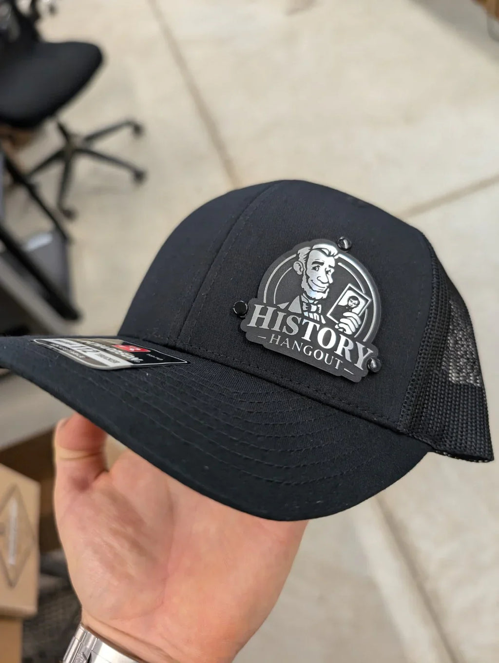Custom Company Badge Hats With Logo - Mesh Trucker Hat – Brushed Silver/Black Badge - Economy - Headgear Hats